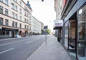 a street with a sign on the side of the road at Eight Rooms in Stockholm