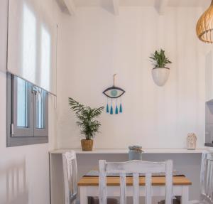 a dining room with a table and chairs at Small Paradise in Andros