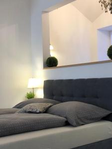 A bed or beds in a room at Frank Apartman Deluxe