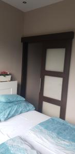 Posteľ alebo postele v izbe v ubytovaní Blue Ball Apartment