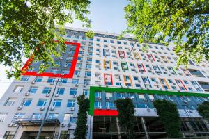 a building with a red sign on the side of it at New quiet place in Kiev in Kyiv