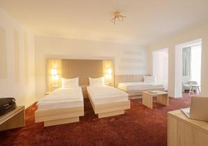 Postel nebo postele na pokoji v ubytování Hotel Brenner