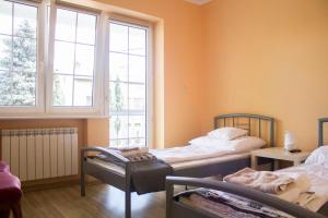 Posteľ alebo postele v izbe v ubytovaní Magic Garden Hostel