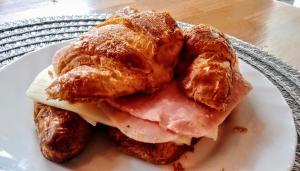 a sandwich with ham and cheese on a plate at Malaga City Breaks in M&aacute;laga