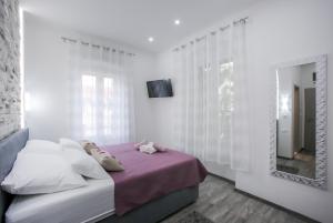 Postel nebo postele na pokoji v ubytování D&D Suites in Split Centre