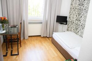 Ein Bett oder Betten in einem Zimmer der Unterkunft Hotel Stern