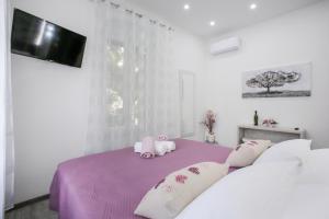 Postel nebo postele na pokoji v ubytování D&D Suites in Split Centre