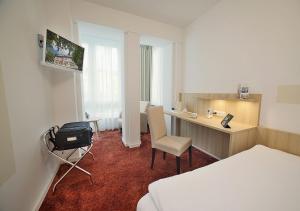 TV a/nebo společenská místnost v ubytování Hotel Brenner