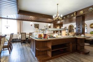 a kitchen with a large island in a room at Hotel Alpina Superior in Pettneu am Arlberg