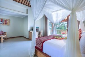Postel nebo postele na pokoji v ubytování Nata Ubud