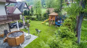 an aerial view of a backyard with a playground at Willa u Baranów in Zakopane