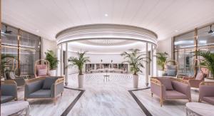 a rendering of a lobby with chairs and a pool at The Prestige Hotel Penang, a Member of Design Hotels in George Town