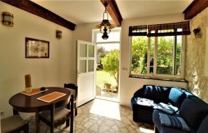 a living room with a couch and a table at Apartments VESNA in Pag