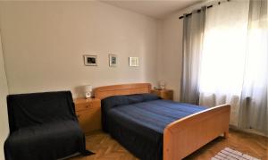 Łóżko lub łóżka w pokoju w obiekcie Apartments VESNA