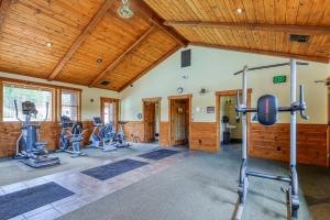 a gym with exercise equipment and wooden ceilings at Dolomite Delight in Truckee