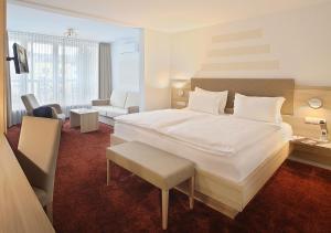 Postel nebo postele na pokoji v ubytování Hotel Brenner