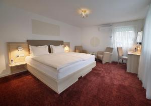 Postel nebo postele na pokoji v ubytování Hotel Brenner