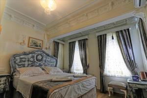 Säng eller sängar i ett rum på Romantic Mansion
