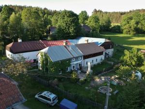 an aerial view of a house with a car parked in front at Opolenec in Kašperské Hory