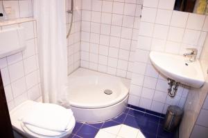 Ein Badezimmer in der Unterkunft Hotel Stern