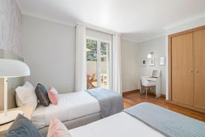 Postel nebo postele na pokoji v ubytování Grand Residence I by An Island Apart