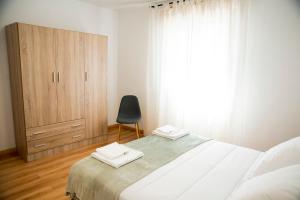 A bed or beds in a room at Casa Mamalola