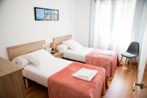 A bed or beds in a room at Casa Mamalola
