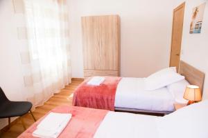 A bed or beds in a room at Casa Mamalola
