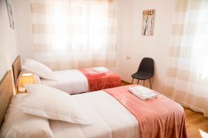 A bed or beds in a room at Casa Mamalola
