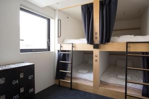 Postel nebo postele na pokoji v ubytování Piece Hostel Kyoto