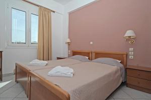 Postel nebo postele na pokoji v ubytování Theodosia Apartments