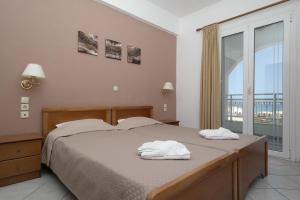 Postel nebo postele na pokoji v ubytování Theodosia Apartments