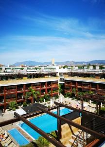 a view from the balcony of a hotel with a pool at Gran Hotel Guadalpín Banus in Marbella