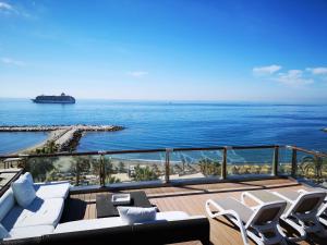 a balcony with a view of the ocean at Gran Hotel Guadalpín Banus in Marbella