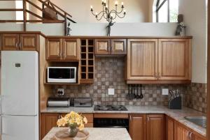 Kuchyň nebo kuchyňský kout v ubytování Ama Casa Cottages + 32 fotografií
