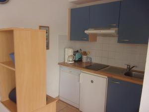 Kuchyň nebo kuchyňský kout v ubytování Appartement tout confort dans résidence avec piscine