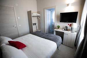 Postel nebo postele na pokoji v ubytování Lo Stallone -Malpensa Milan airport