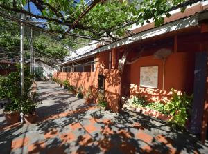 a courtyard of a building with plants on it at Christys Palace Hotel in Pedoulas