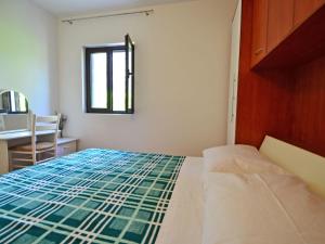 Postel nebo postele na pokoji v ubytování Holiday Home Nikolina by Interhome