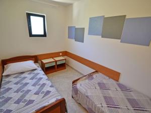 Postel nebo postele na pokoji v ubytování Holiday Home Nikolina by Interhome