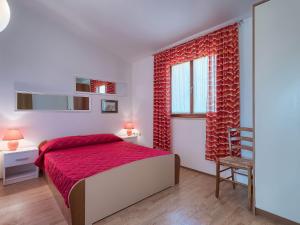 En eller flere senge i et værelse på Apartment Ulika by Interhome