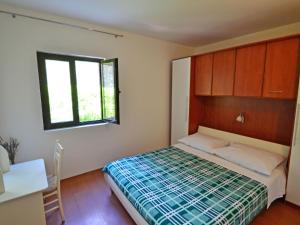 Postel nebo postele na pokoji v ubytování Holiday Home Nikolina by Interhome