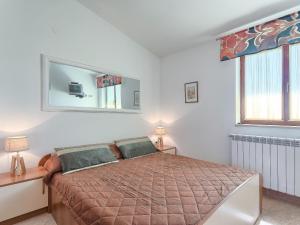 En eller flere senge i et værelse på Apartment Ulika by Interhome