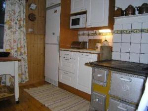 Kuchyň nebo kuchyňský kout v ubytování Holiday Home Simola by Interhome