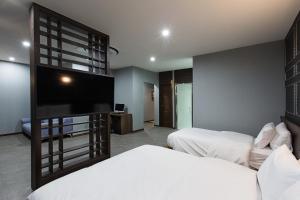 TV a/nebo společenská místnost v ubytování Notte La Mia Hotel