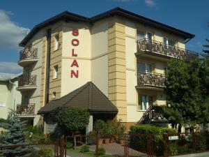 a building with a sign that reads hotelosa nations at Willa Solan in Ciechocinek