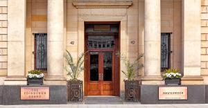 a building with a wooden door in front of it at Cheval The Edinburgh Grand in Edinburgh