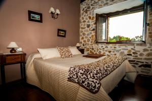 Cama o camas de una habitación en Apartamentos Rurales Larrago