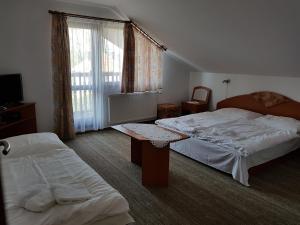Postel nebo postele na pokoji v ubytování Guest House Boba