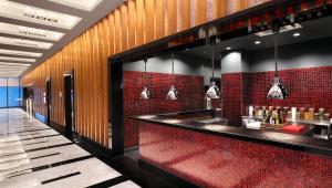 a bar in a restaurant with a red brick wall at Surmeli Istanbul Hotel in Istanbul